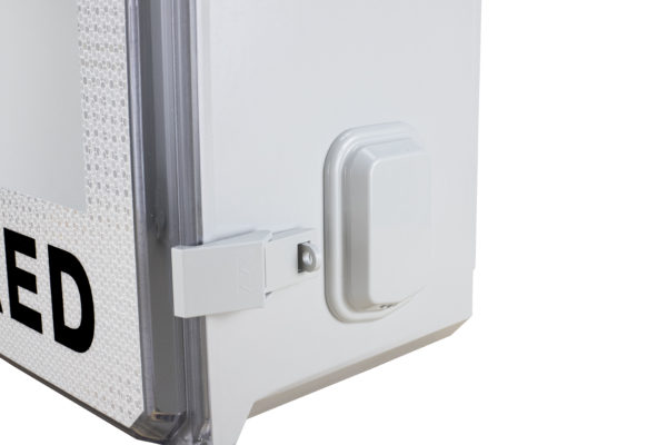 Detail view of latch and vent cover on outdoor AED wall cabinet