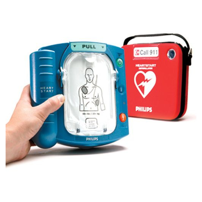 Philips Onsite AED in a person's hand, next to a carry case.